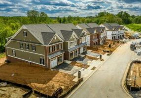 Elevated view of almost finished luxury townhouses with two sing Elevated view of almost finished luxury townhouses with two sing